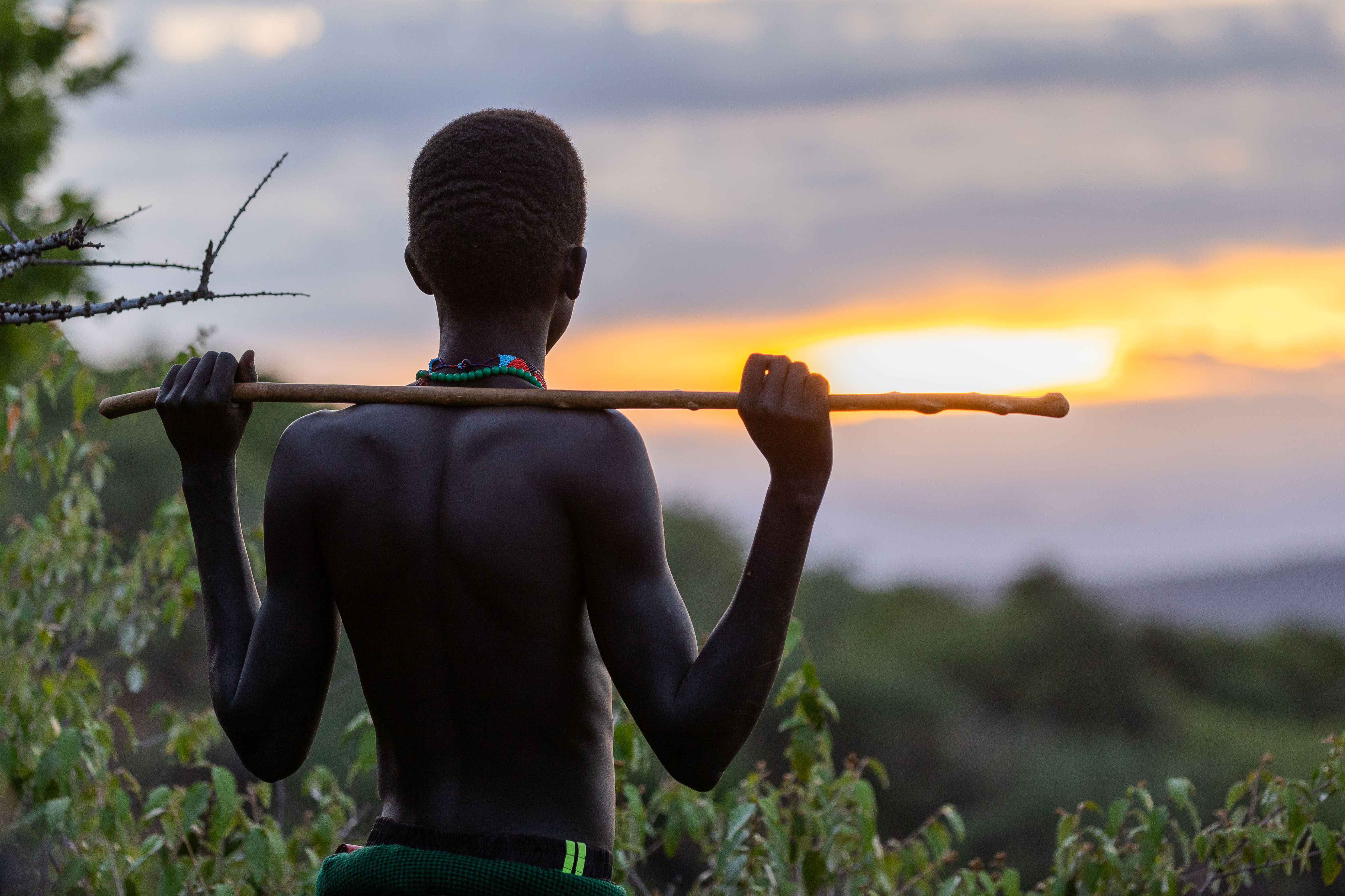 Young herder watching the sunset